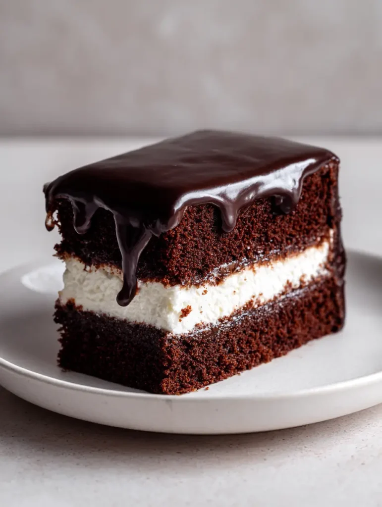 Ding Dong Cake Recipe: The Ultimate Homemade Dark Chocolate Nostalgia Cake 1 Natural daylight photo of a glossy ganache-covered Ding Dong Cake slice. (Ding Dong Cake Recipe)