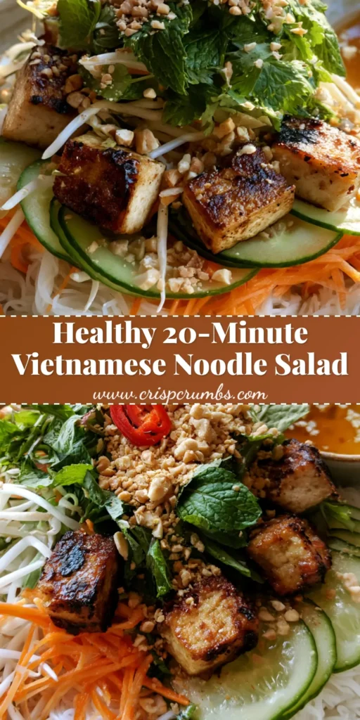 A shallow ceramic bowl of Vietnamese Noodle Salad featuring bright white rice vermicelli, golden-brown tofu, julienned carrots, and fresh mint leaves.